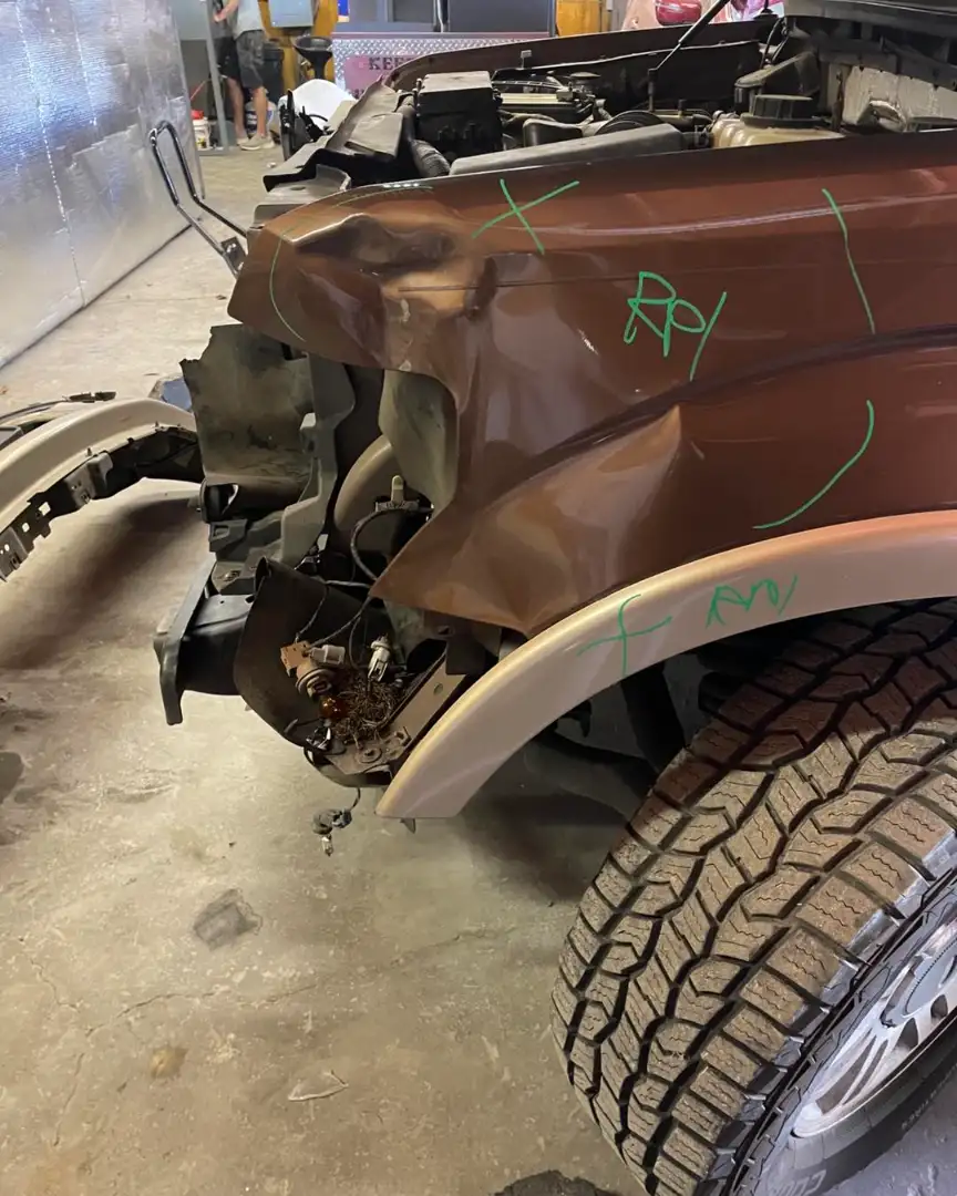 Ford vehicle showing collision damage before repair in Springtown